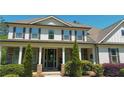 Inviting front porch features stone pillars and a stylish entryway at 140 Discovery Lake Dr, Fayetteville, GA 30215