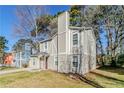 Inviting home with neat lawn, neutral siding and driveway at 6218 Creekford Ln, Lithonia, GA 30058