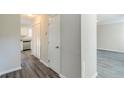 Hallway with new gray flooring and white trim at 6218 Creekford Ln, Lithonia, GA 30058