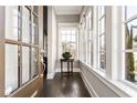 Light-filled entryway with windows shows off the stylish door and flower arrangement at 6669 Encore Blvd, Atlanta, GA 30328