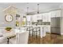 Bright kitchen with white cabinets, stainless appliances, and a large island at 6669 Encore Blvd, Atlanta, GA 30328