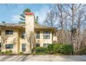 Charming condo exterior featuring multiple windows that invite natural light and cozy outdoor living at 806 Lismore Se, Smyrna, GA 30080