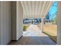 View of the carport, providing covered parking and leading to the front entrance of the house at 2419 Leslie Brook Dr, Decatur, GA 30035