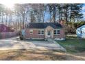 Attractive brick home with stone details, complemented by a well-kept lawn and convenient driveway at 4809 Lavista Rd, Tucker, GA 30084