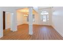 Elegant foyer with hardwood floors, chandelier, and view of the front door at 2474 Starfire Ln, Loganville, GA 30052