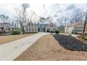 Lovely single Gathering home featuring well maintained landscaping and a long drive way at 814 Oak Moss Dr, Lawrenceville, GA 30043