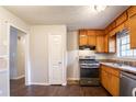 Functional kitchen featuring wood cabinets, gas range, and stainless steel dishwasher at 2897 Hedgewood Nw Dr, Atlanta, GA 30311