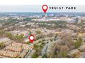 Aerial view of townhomes with a pool in close proximity to Truist Park and surrounding area at 2826 Loftview Sq # 4, Atlanta, GA 30339