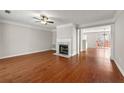 Bright living room boasts hardwood floors, fireplace, and elegant trimwork at 1381 Vintage Pointe Dr, Lawrenceville, GA 30044