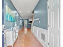 Inviting entryway with hardwood floors, fresh paint, white trim, and a view to the main living area at 340 Lazy Willow Ln, Lawrenceville, GA 30044