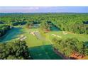 Picturesque aerial view of the meticulously maintained golf course, complete with water hazards at 61 Colonial Terrace, Villa Rica, GA 30180