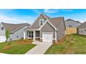 Single-Gathering home boasts a manicured lawn, a one-car garage, and pleasing gray siding at 71 Colonial Terrace, Villa Rica, GA 30180