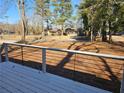 Relaxing view from the deck, highlighting the neighborhood's peaceful surroundings and natural scenery at 1580 Turner Rd, Cumming, GA 30041