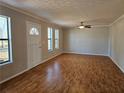 Bright living room with natural light, featuring hardwood floors and neutral paint, ready for personalization at 1580 Turner Rd, Cumming, GA 30041