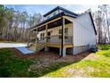 The side of the house shows a well-maintained lawn, providing a serene outdoor space at 279 Laura Cir, Bowdon, GA 30108