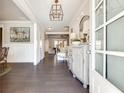 Bright entryway with hardwood floors, elegant decor, and plenty of natural light at 5242 Park Vale Dr, Sugar Hill, GA 30518