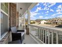 Inviting front porch with comfortable seating and a view of the neighborhood at 170 Wheaten Dr, Woodstock, GA 30188