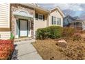 Inviting front entrance with stone accents, green trim, and a well-maintained yard at 1800 Rockdale Cir, Snellville, GA 30078