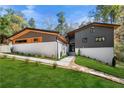 Striking home exterior boasting modern design, white brick accents, and meticulous landscaping at 2751 Margaret Mitchell Nw Dr, Atlanta, GA 30327