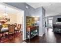 Inviting entryway with hardwood floors and an elegant hall table featuring tasteful decor and artwork at 935 Sunset Ridge Ln, Lawrenceville, GA 30045