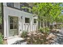 Inviting home entrance with a green door, small porch, and landscaped yard at 321 Dilbeck Ne Cir, Atlanta, GA 30342