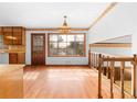 Dining room with hardwood floors, bright windows, a chandelier, and staircase at 2696 Titon Way, Lawrenceville, GA 30044