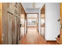 Inviting foyer features hardwood floors, a wooden front door and a view to the dining room at 2696 Titon Way, Lawrenceville, GA 30044