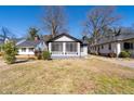 Bungalow-style house with a screened front porch and mature trees in a residential neighborhood at 2147 Cascade Sw Rd, Atlanta, GA 30311