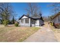 Well-maintained home featuring a charming screened front porch and long driveway at 2147 Cascade Sw Rd, Atlanta, GA 30311