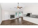 Inviting living space with a fireplace, new flooring, and plenty of natural light at 6304 Marbut Farms Ln, Lithonia, GA 30058