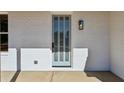 The home features a modern front door with glass panels, set against a white brick facade at 482 Majestic Oaks Pl, Smyrna, GA 30082