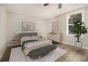 Cozy bedroom with neutral tones, modern furniture, and a large window for natural light at 1705 Evans, Atlanta, GA 30310