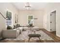 Bright living room with a comfortable sectional sofa, modern decor, and ample natural light at 1705 Evans, Atlanta, GA 30310