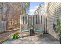 Cozy back patio with seating, a privacy fence, and a serene outdoor space at 2939 Greyhawk Ln, Cumming, GA 30040