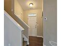 Entryway with stairs leading up, features a white front door and neutral color palette at 1109 Willow Crest Way, Austell, GA 30168