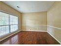 Bright living room with hardwood floors and large window offering plenty of natural light at 1109 Willow Crest Way, Austell, GA 30168