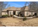 Beautiful brick home with manicured landscaping, attractive architectural details, and a welcoming facade at 490 Revenna Trl, Fayetteville, GA 30214