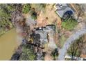 An aerial view showing the house, surrounding landscape and proximity to the water at 3093 Brookshire Way, Duluth, GA 30096