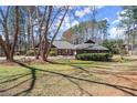 Attractive single-story home with a well-manicured lawn, mature trees, and inviting curb appeal at 3093 Brookshire Way, Duluth, GA 30096