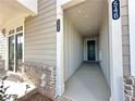 Exterior entrance showing unit numbers and private access at 542 Sawnee Village Blvd # D69, Cumming, GA 30040
