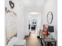 Bright hallway featuring hardwood floors, leading to an open-concept layout at 7652 Baron Rd, Fairburn, GA 30213