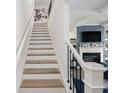 Elegant staircase leading to the upper level of the home at 7652 Baron Rd, Fairburn, GA 30213