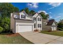 Lovely traditional-style home with an attached two-car garage and a spacious driveway at 2845 White Blossom Ln, Suwanee, GA 30024