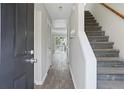 Inviting entryway featuring wood-look floors and a staircase leading to the upper level at 3188 Kingswood Gln, Decatur, GA 30034