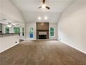 Spacious living room with carpet, fireplace, and natural light at 1280 Pinyon Pl, Lawrenceville, GA 30043