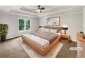 Stylish main bedroom with tray ceilings and neutral decor at 1280 Pinyon Pl, Lawrenceville, GA 30043