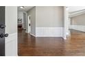 Inviting entryway with hardwood floors and white wainscoting, leading to the living spaces at 5060 Winship Ct, Alpharetta, GA 30009