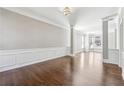 Spacious living room featuring hardwood floors, neutral paint colors, and large windows at 5060 Winship Ct, Alpharetta, GA 30009
