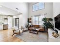 Bright living room boasts soaring ceilings, modern furnishings, and hardwood floors at 142 Perimeter Walk, Atlanta, GA 30338