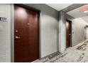 Hallway featuring unit door and carpet at 400 W Peachtree Nw St # 3204, Atlanta, GA 30308